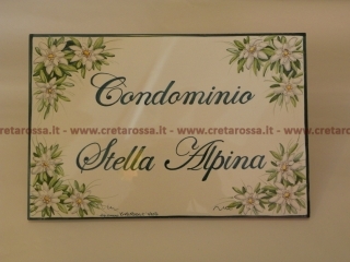 cod.art: nc19 - Mattonella in ceramica cm 20x30 con stelle alpine e scritta personalizzata. 